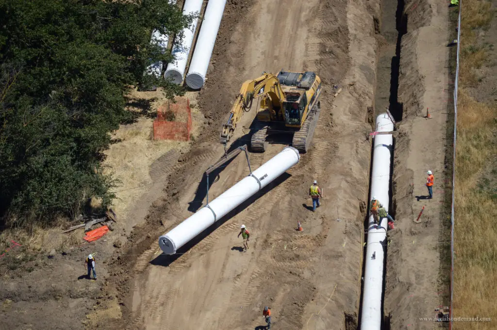 Aerial view of crews assessing steel pipes during North Marin Aqueduct Relocation project