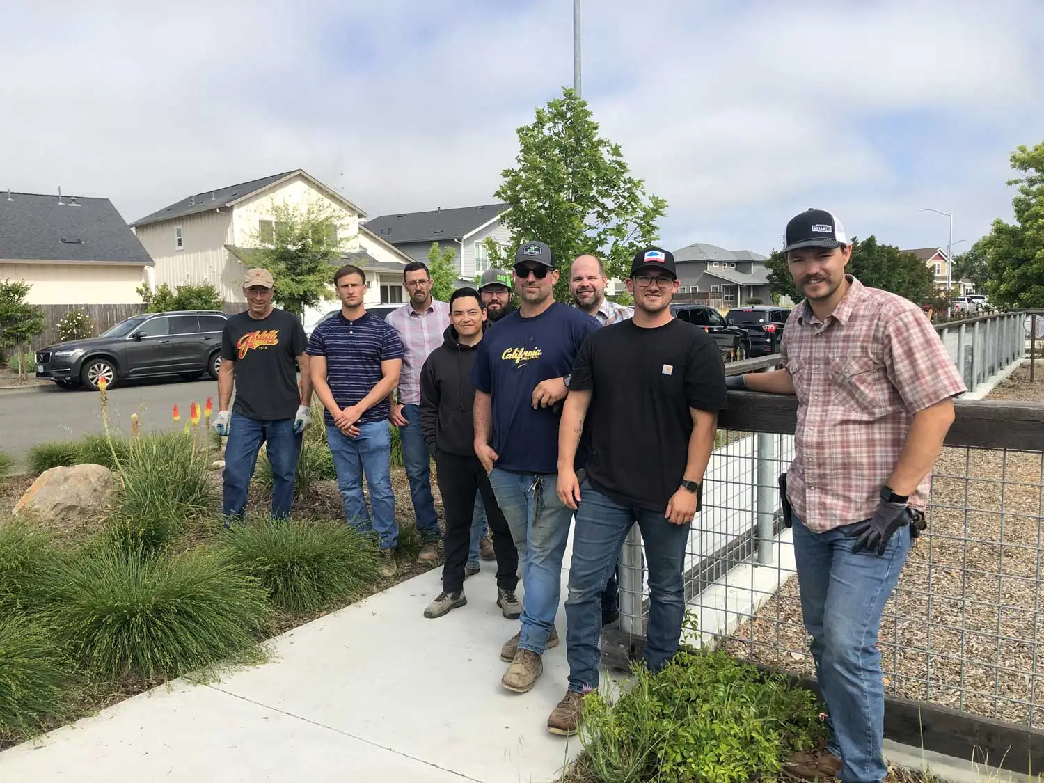 A group of Ghilotti employees gather near completed community park project